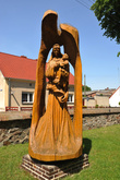 A sculpture in front of the church in Nowe Kramsko portraying Blessed Virgin Mary and Child.